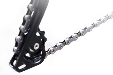 Bicycle wheel and gear detail with a new clean chain and small chain ring of the rear mountain bike...
