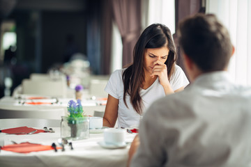 Worried doubtful woman arguing with her husband.Emotional stressed woman having problems in marriage.Relationship fight.Sad domestic abuse victim.Reaction to bad news,confession.Feeling discomfort - obrazy, fototapety, plakaty
