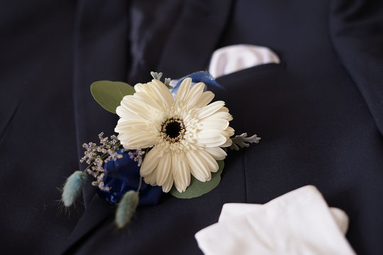 Corsage Boutonniere Brooch On A Man Groom Suit On Wedding Day.