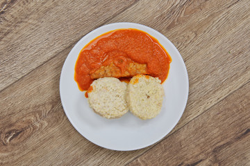 Tomto sauce with dumpling on a table