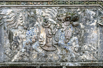 bas-reliefs in the complex of the mausoleum of the emperor Tu Duc in Hue, Vietnam.