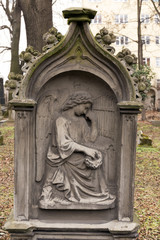 Fototapeta na wymiar Historic sculpture from the mystery old Prague Cemetery, Czech Republic