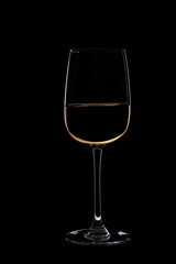 Glass of white wine on the black background.