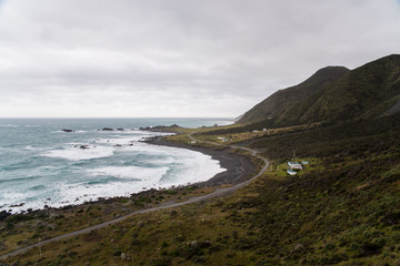 Fototapeta na wymiar Landscape view of a road next to the ocean in New Zealand. 