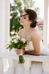 Beautiful brunette bride portrait in summer park