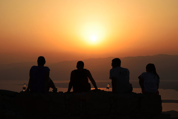 Fototapeta na wymiar People watching sunrise from Masada, Israel 