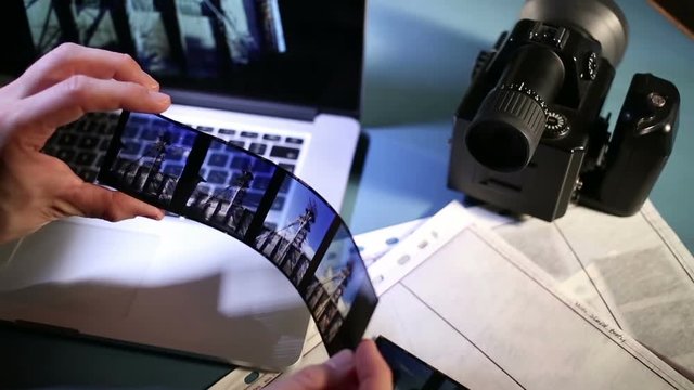 Examining shoot on computer and medium format color reversal film.