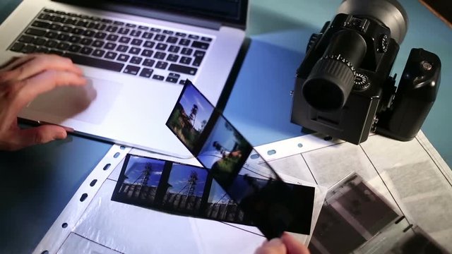 Examining shoot on computer and medium format color reversal film.