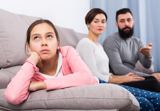 Parents lecturing daughter