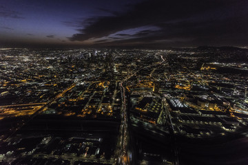Night aerial view of the Hollywood 101 freeway passing through downtown Los Angeles California.