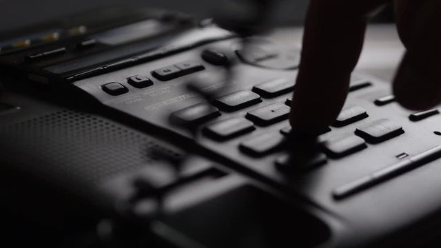 Finger Dials The Number On The Button Phone