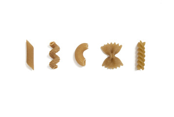 selection of whole grain pasta uncooked, isolated
