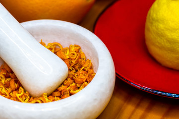 White marble mortar with the orange zest