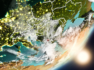 Sun rising above Kosovo from space