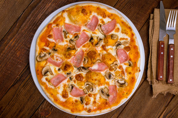 Pizza with ham and mushrooms