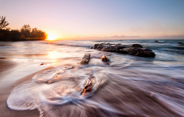 colorful sunset seascape with waves trails at Kudat Sabah Malaysia. 
