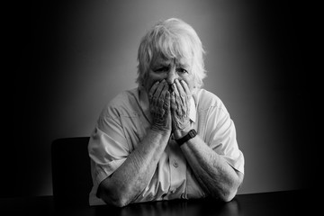 Elderly woman distressed, upset and sad