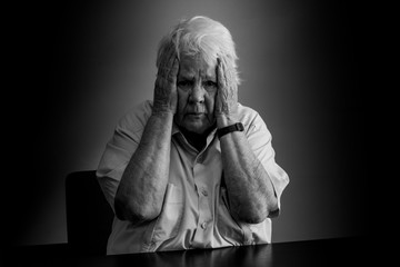 Elderly woman distressed, upset and sad