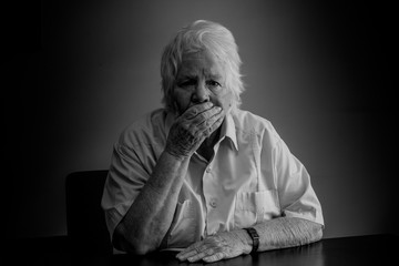 Elderly woman distressed, upset and sad