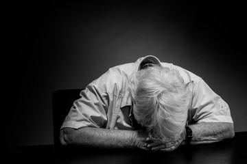 Elderly woman distressed, upset and sad