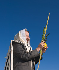 Man holding lulav for sukkot