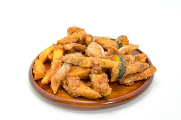 Fried banana fritters on with wood plate white background