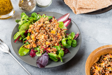 Red rice, lentils and butternut squash with carrot and quinoa in
