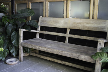 Wooden bench in home garden