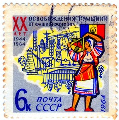 USSR - CIRCA 1964: A stamp printed in USSR shows Flag, Map, Woman with inscription "Romanian People's Republic 20 years".