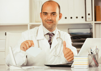 Male working in medical Center at the laptop