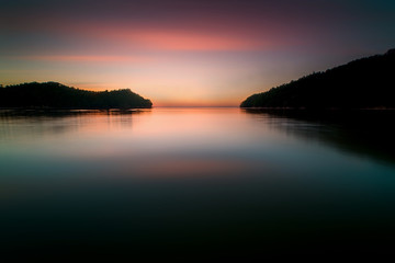 Fototapeta premium long expose sunset seascape with waves trails. image contain soft focus due to slow shutter.