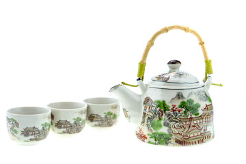 Teapot with cups on a white background.