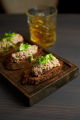 bruschetta, on slices of toasted baguette garnished with basil