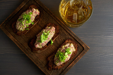 bruschetta, on slices of toasted baguette garnished with basil