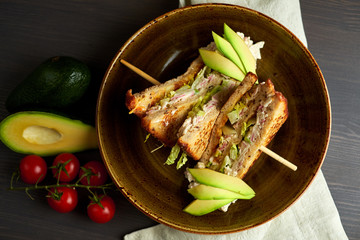 Top view of Healthy Sandwich toast with lettuce, ham, cheese and tomato on a wooden background
