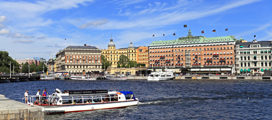 Stockholm, Sweden - Norrmalm district view from Old town quarter Gamla Stan - Baltic sea harbor piers and most prominent shoreline residences - obrazy, fototapety, plakaty