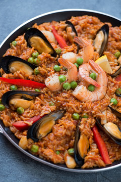 Closeup of spanish paella with seafood, vertical shot, selective focus