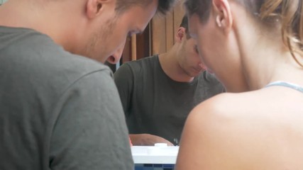 couple brushing teeth together in the bathroom