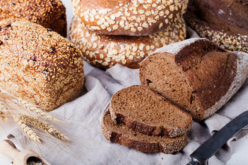 Fresh bread assortment on a textile background.