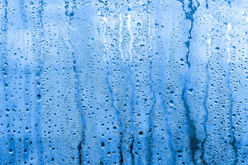 texture background wet drops of water dew on misted glass