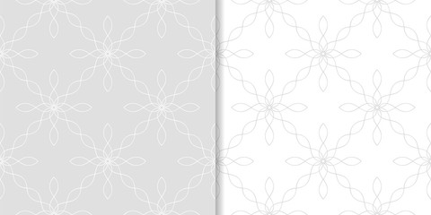 Light gray geometric ornaments. Set of seamless patterns