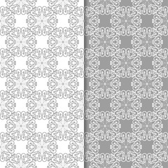 White and gray floral backgrounds. Set of seamless patterns