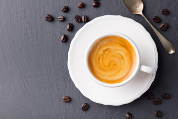 Coffee espresso in white cup. Copy space. Top view