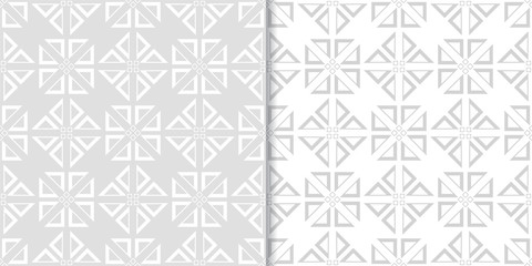 Light gray geometric ornaments. Set of seamless patterns