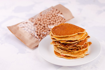pancakes or fritters of chickpeas flour - vegetarian snack