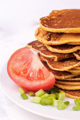 fried pancakes or fritters are stacked - a traditional dish for carnival, a serving option