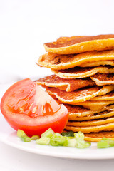 fried pancakes or fritters are stacked - a traditional dish for carnival, a serving option