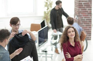 young designer on the background of the creative office.