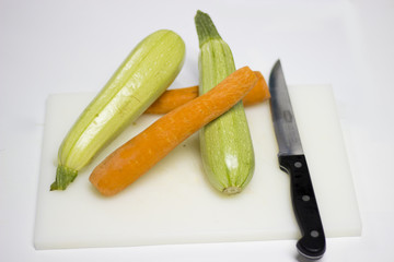 zucchini and carrots on white background.