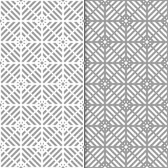 Gray and white geometric ornaments. Set of seamless patterns